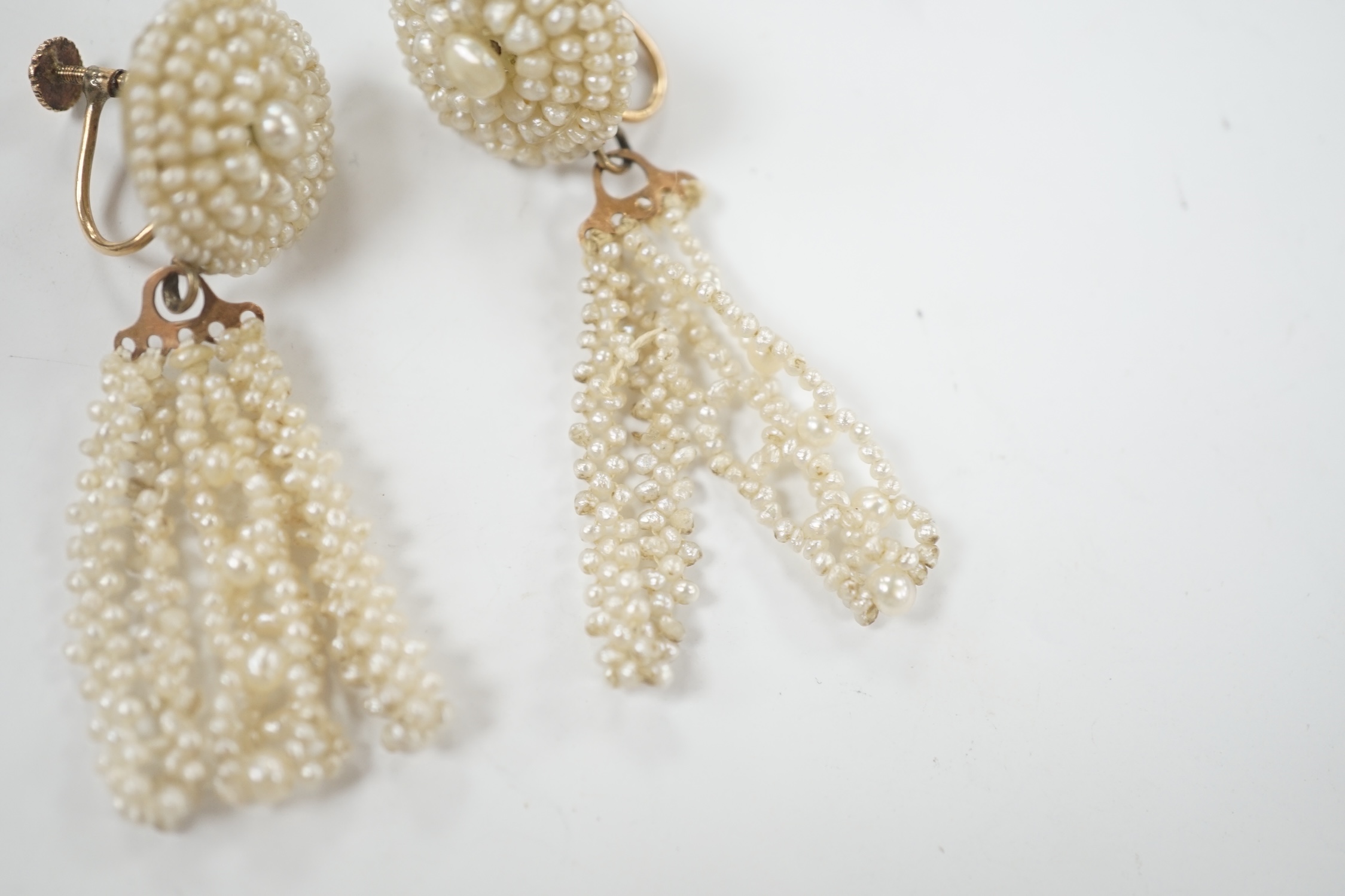 A pair of 19th century yellow metal and seed pearl cluster set tassel drop ear clips, 47mm.